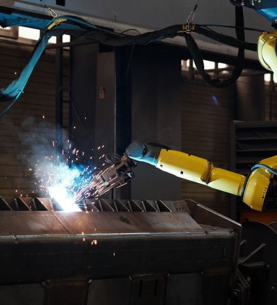 Arc welding of huge industrial machine during process of repairing